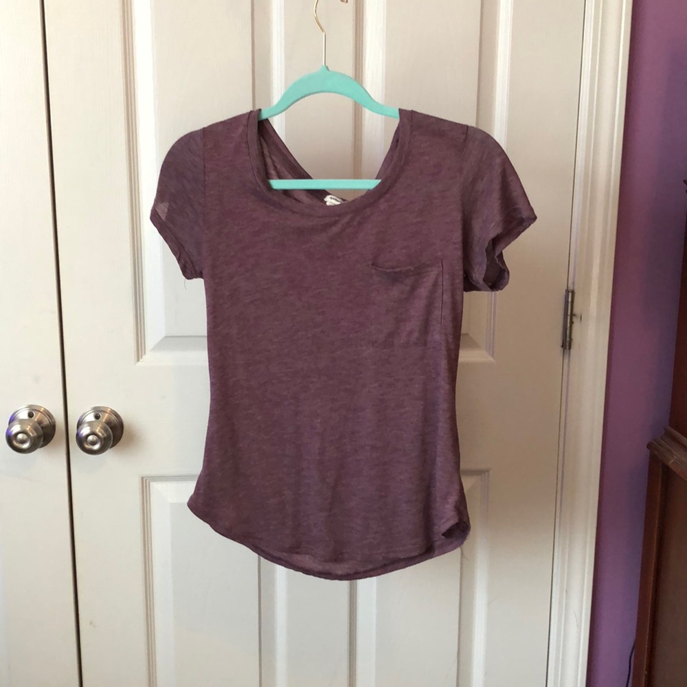 This is a maroon top with a front chest pocket